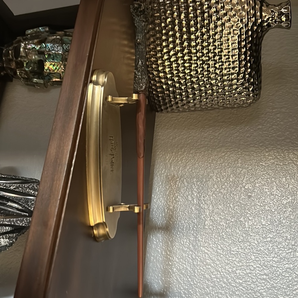 Harry Potter wand and gold stand from Universal Studios